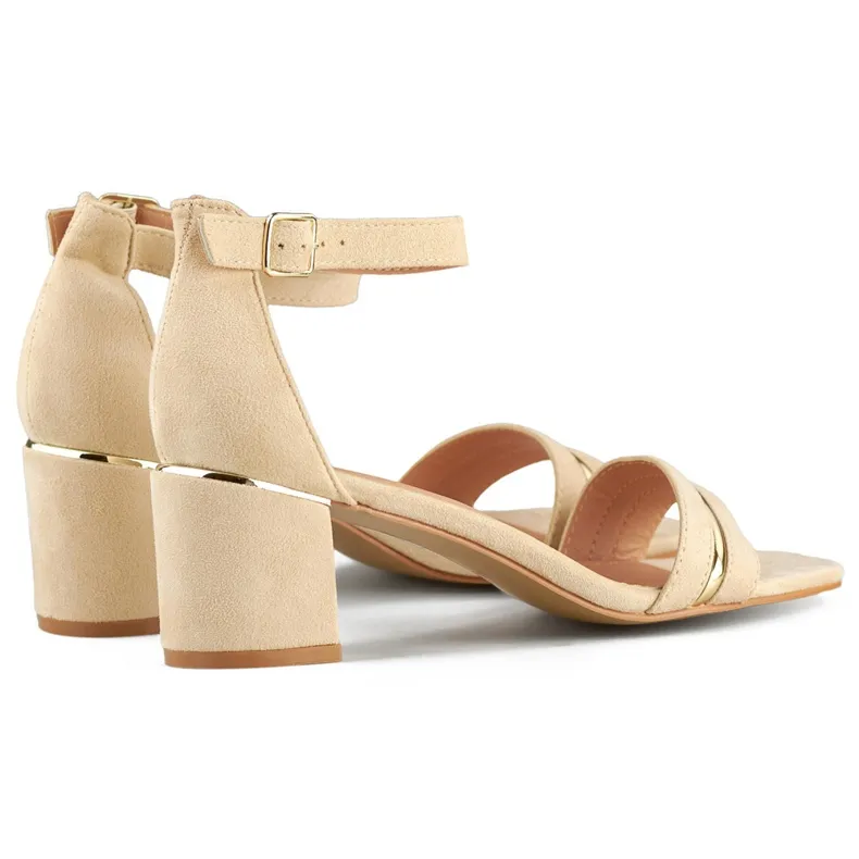 Beige women's low-heeled sandals with ankle fastening